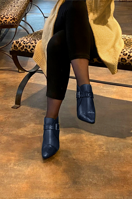 Navy blue women's ankle boots with buckles at the front. Tapered toe. Very high kitten heels. Worn view - Florence KOOIJMAN